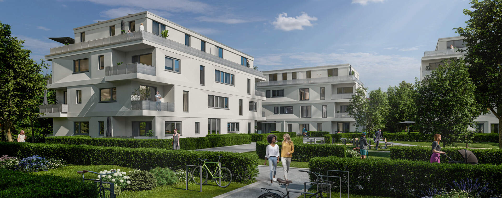 Moderne Wohnanlage mit hellen Fassaden, grünen Gärten und freundlicher Nachbarschaft. Ideal für Familien.